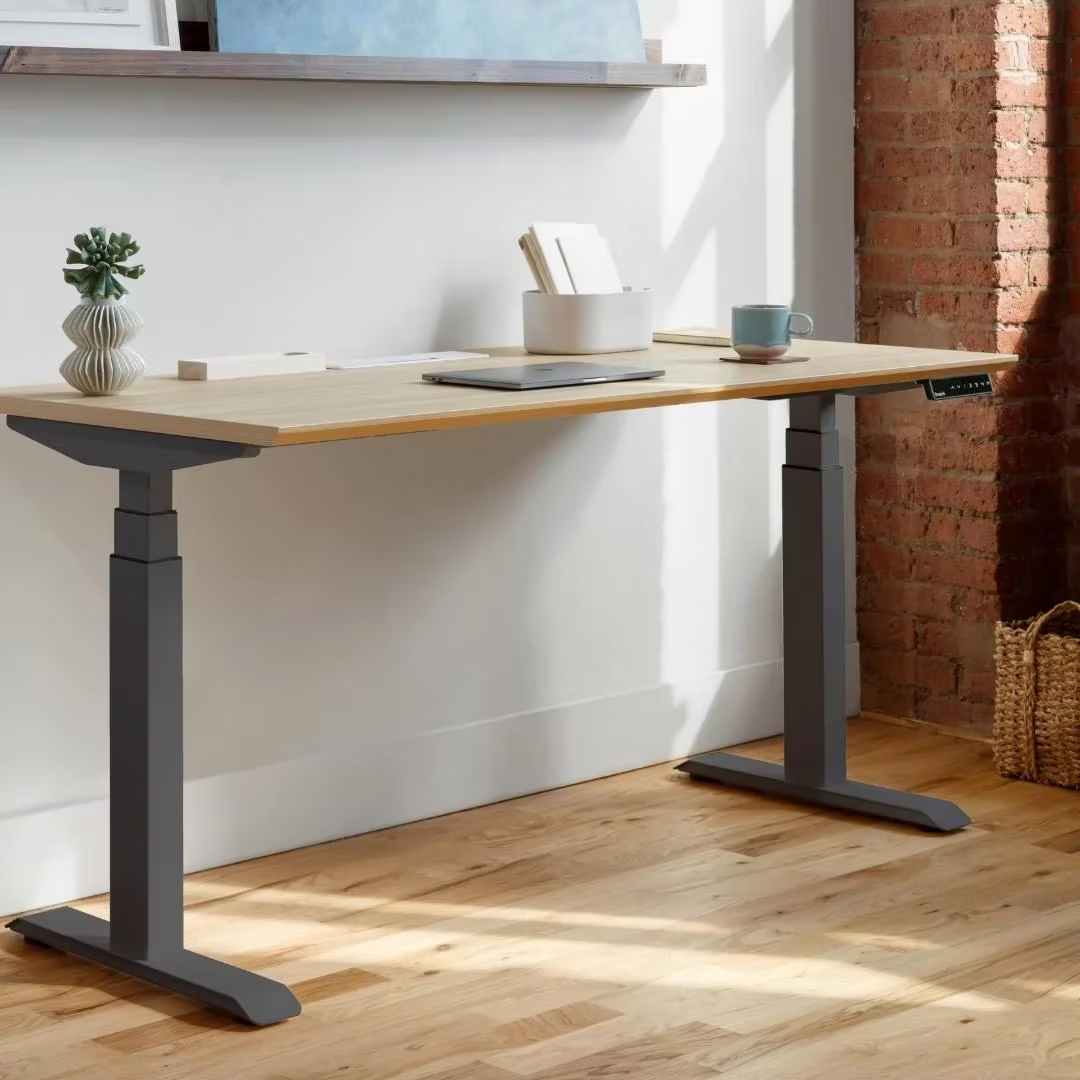 Modern office desks including ergonomic sit-stand and executive designs