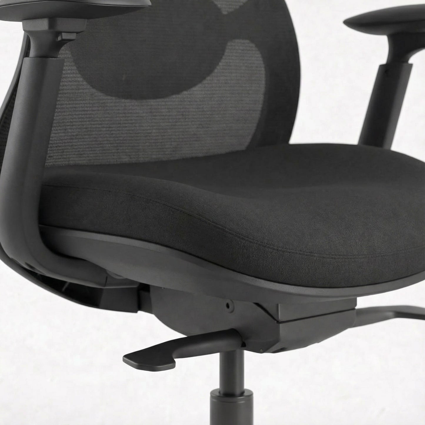 Black ergonomic office chair with mesh backrest on a white background