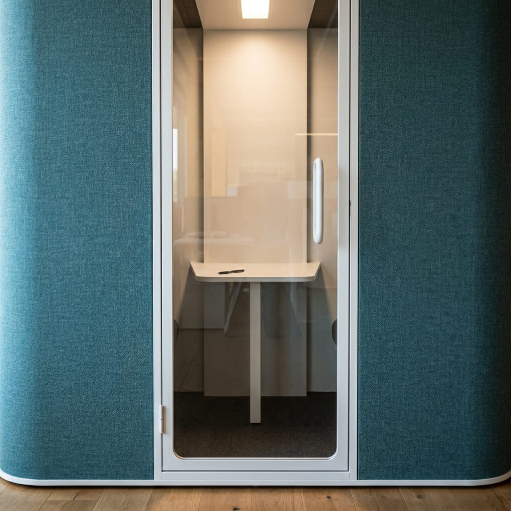 Close-up of the ChatterBox Classic 2-seater pod showing its acoustic fabric finish and rounded corners