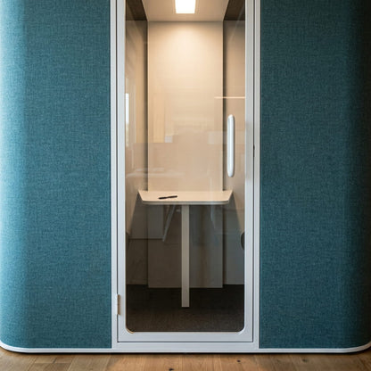 Close-up of the ChatterBox Classic 2-seater pod showing its acoustic fabric finish and rounded corners
