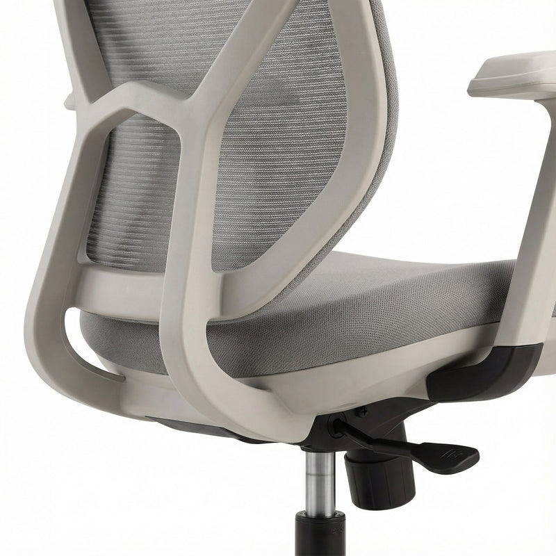 Gray office chair with mesh backrest on a white background and soft seat