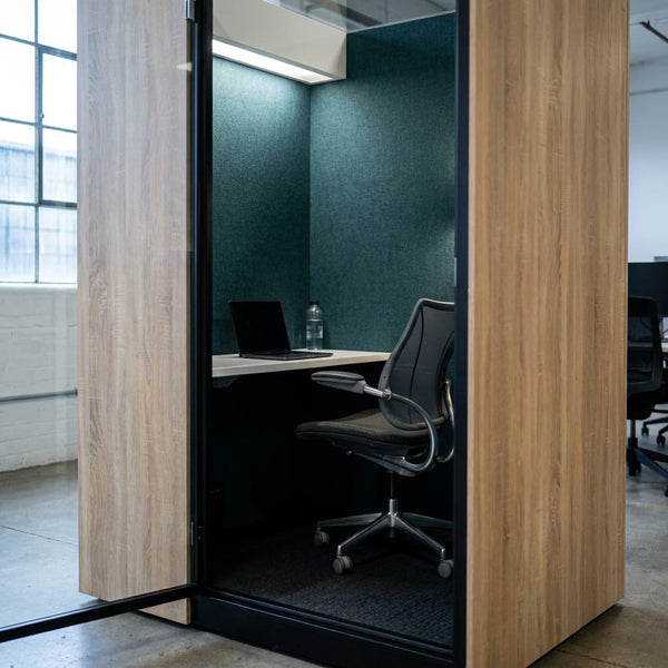SkyLite Solo Focus Task Pod with the door open, showing the interior work surface and seating