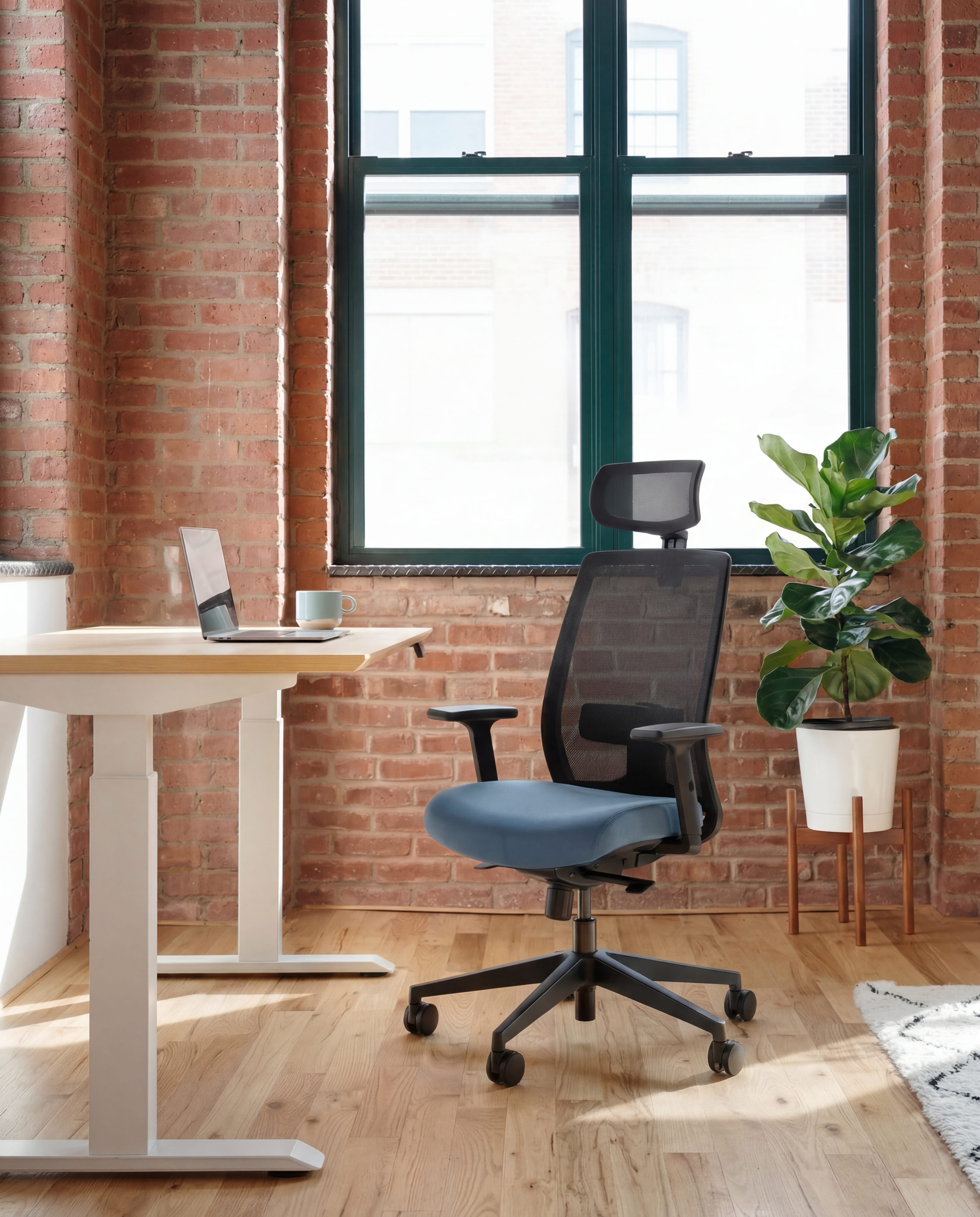 Modern office space with standing desk and ergonomic office chair 