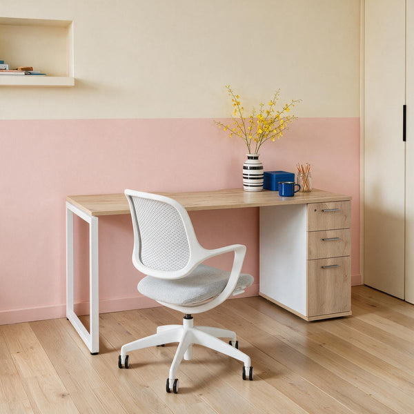 Barrel Oak home office desk with built-in drawers and a white frame, styled with an ergonomic task chair