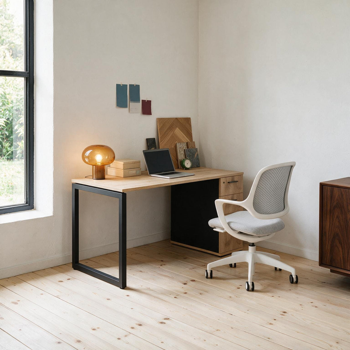 The Solo Desk with Storage in Barrel Oak and black, paired with an ergonomic task chair
