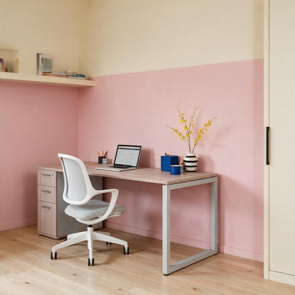 The Solo Desk with Storage set up in a home workspace with the drawers on the right-hand side