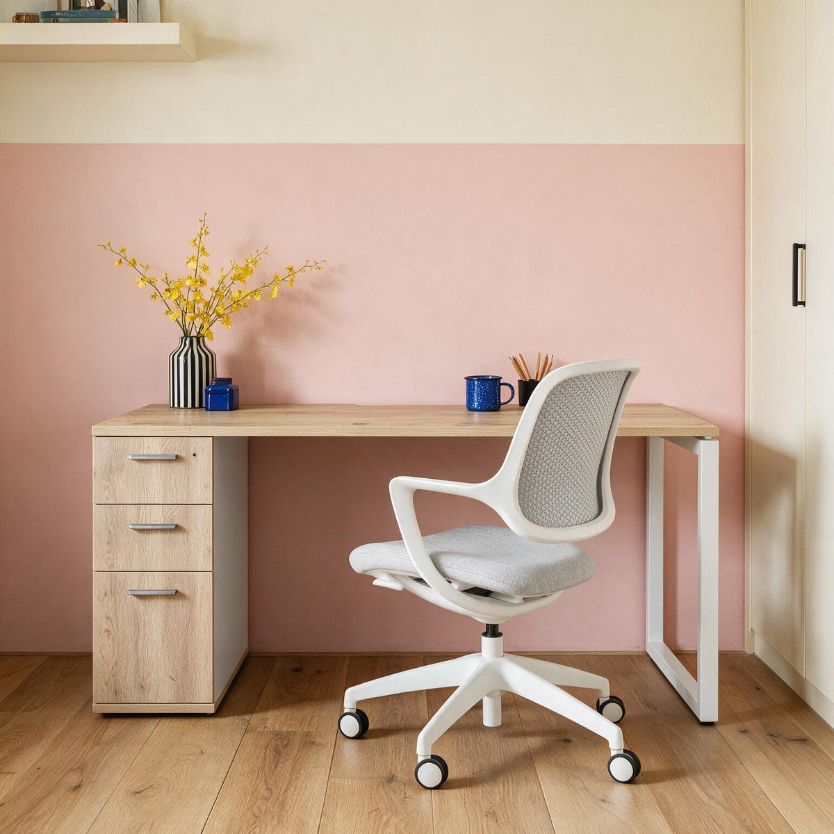 Single home office desk with drawers built into the steel frame, in a styled room setting