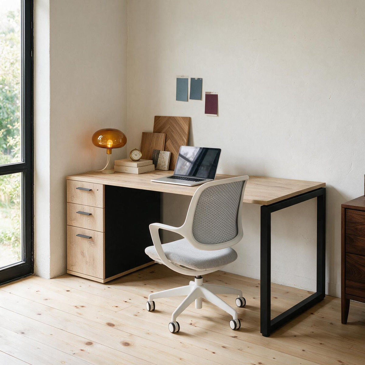 Home office desk with built-in drawers, shown in a lived-in room setting