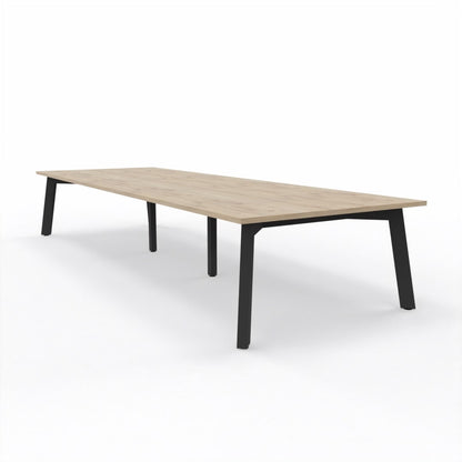 Large XXL Boardroom table with light oak top and 4 legged black steel frame on a white background