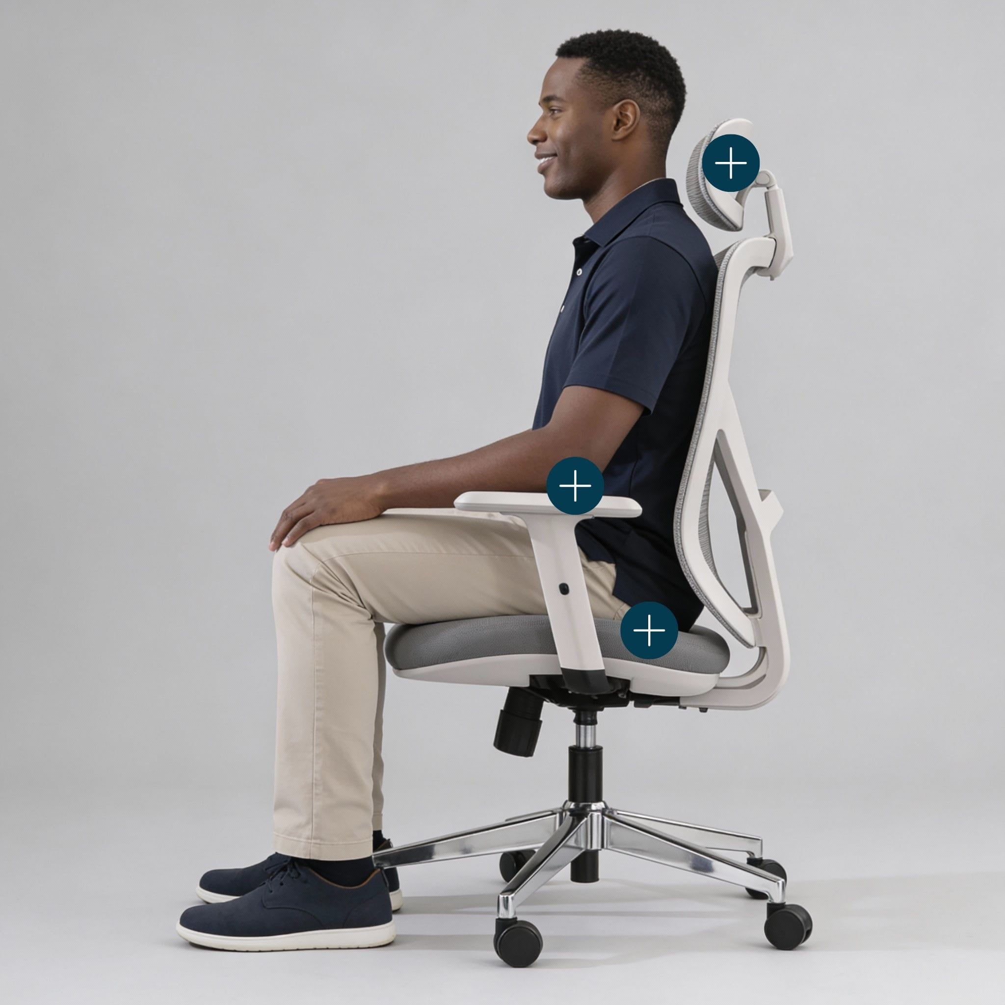 Man sitting on a ergonomic office chair with highlighted features on a gray background