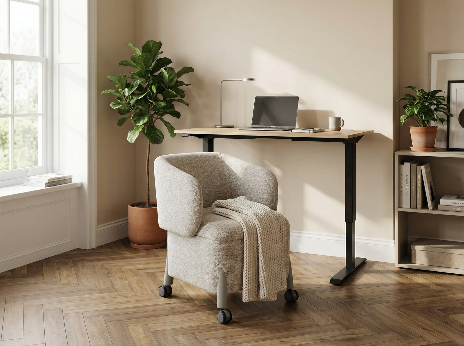 Home office with a height adjustable desk, soft seating office chair, and plants in a well-lit room.