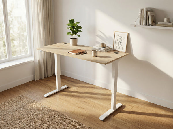 Height Adjustable standing desk with white legs in a bright room with a plant and books on it.
