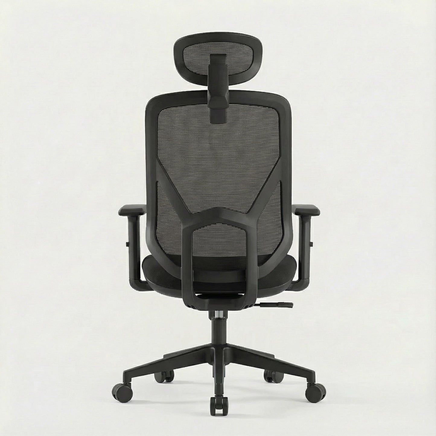 Black ergonomic office chair with mesh back and a mesh headrest on a white background