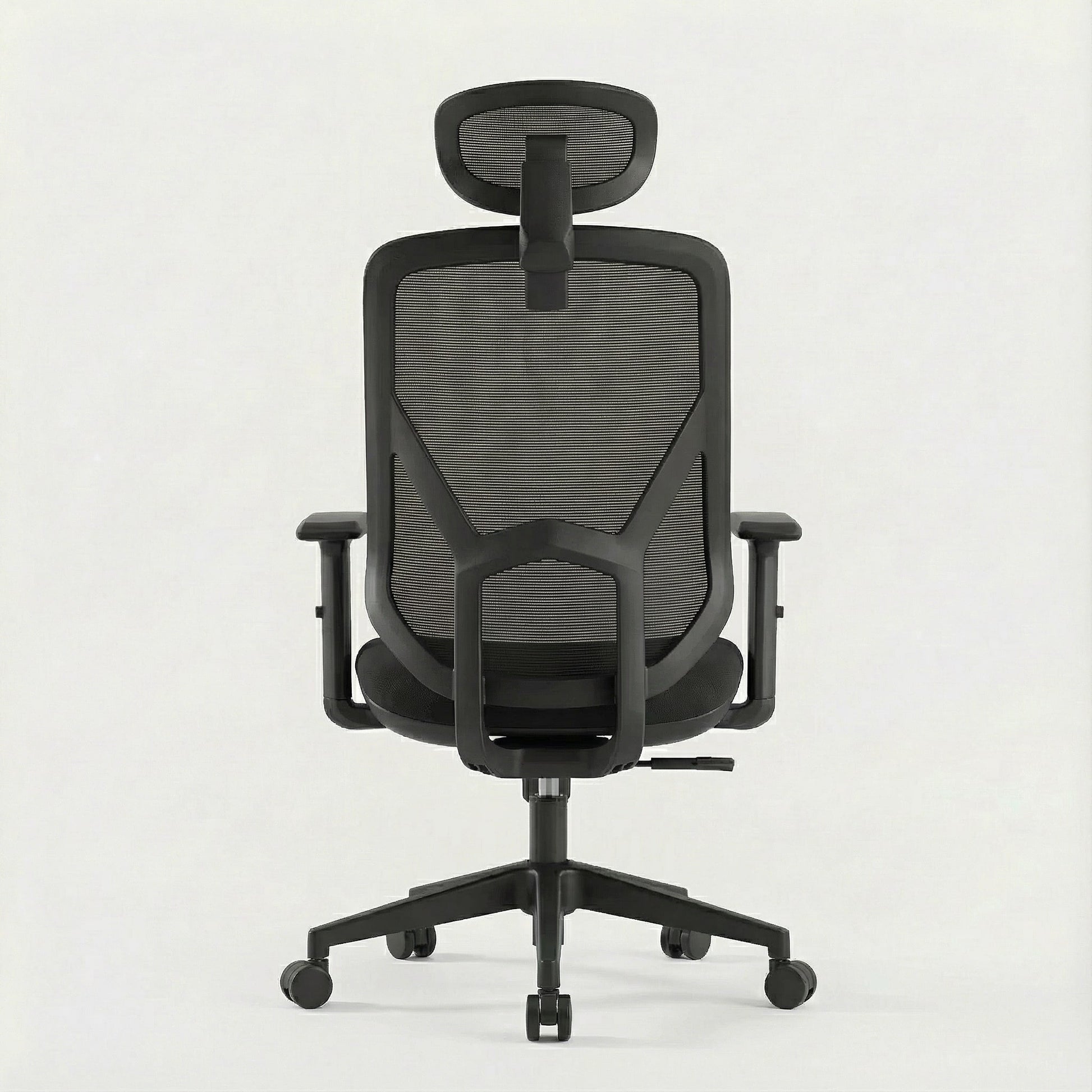 Black ergonomic office chair with mesh back and a mesh headrest on a white background