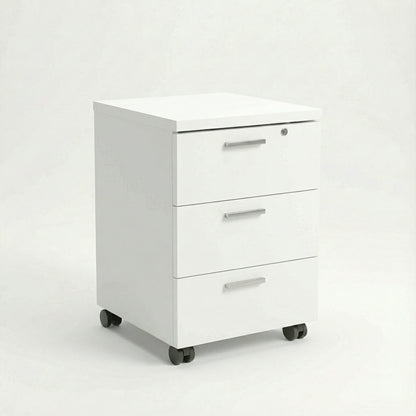 White mobile storage unit with three drawers and silver handles on black caster wheels in a studio room 