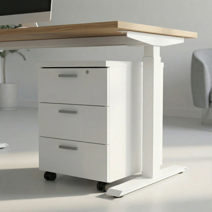 white storage with three drawers on wheels under a white framed sit stand height adjustable desk in a modern office room