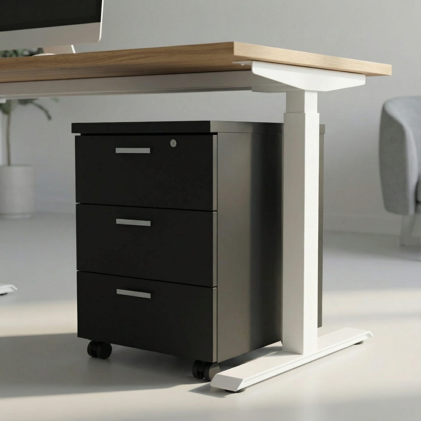 black storage with three drawers on wheels under a white framed sit stand height adjustable desk in a modern office room