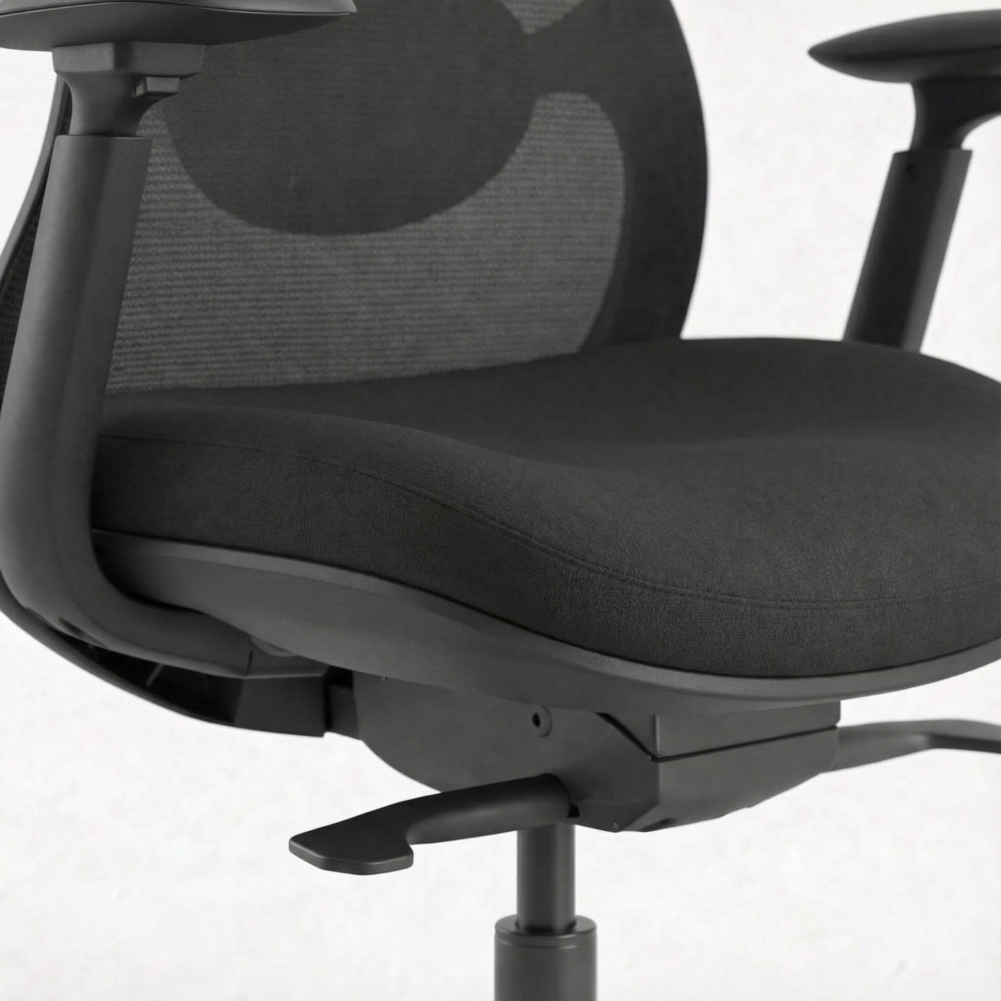 Black ergonomic office chair with mesh backrest on a white background