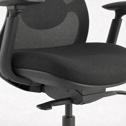 Black ergonomic office chair with mesh backrest on a white background