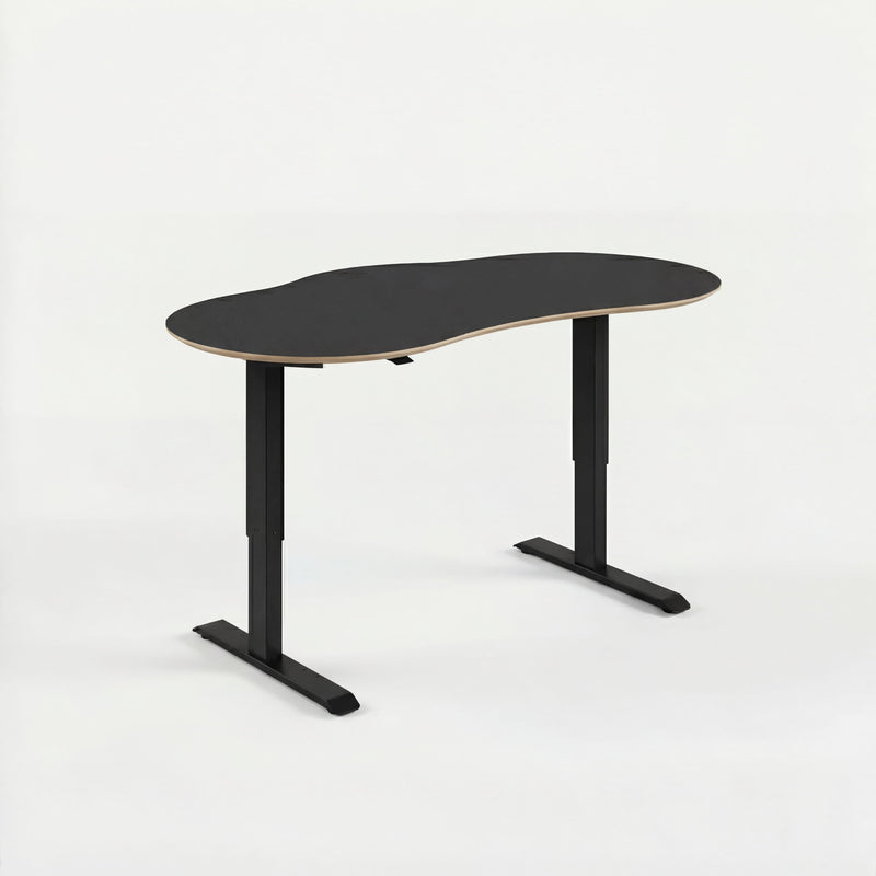 Modern black sit stand desk with a white background