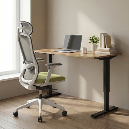 Modern office setup with a white ergonomic chair with mesh headrest, height adjustable sit standdesk, and computer.