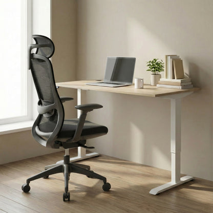 Modern office setup with a height adjustable desk and ergonomic office chair.