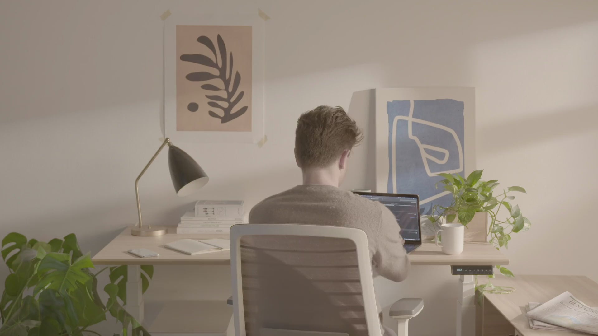 Load video: Premium electric sit-stand desk with sleek woodgrain top and white frame