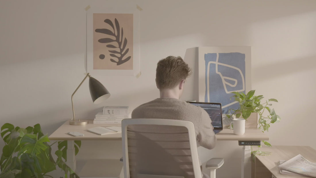 Premium electric sit-stand desk with sleek woodgrain top and white frame